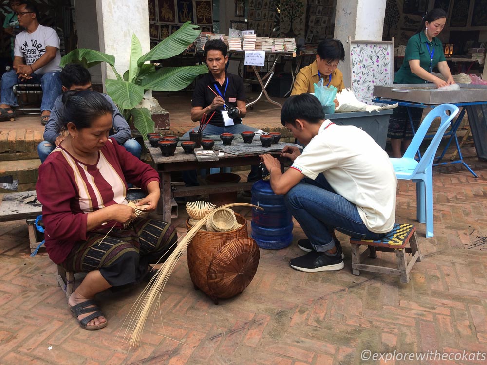 Laotian locals busy with making handicrafts