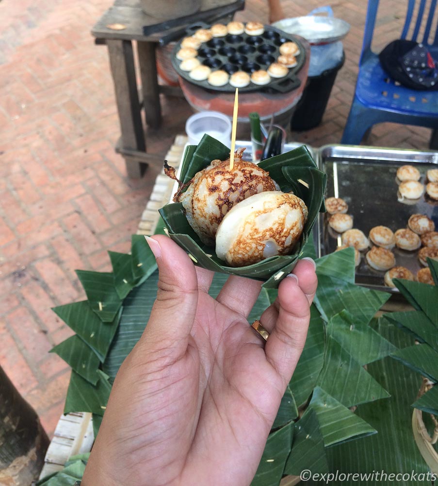 Trying out the coconut pancakes at Luang Prabang Night Market