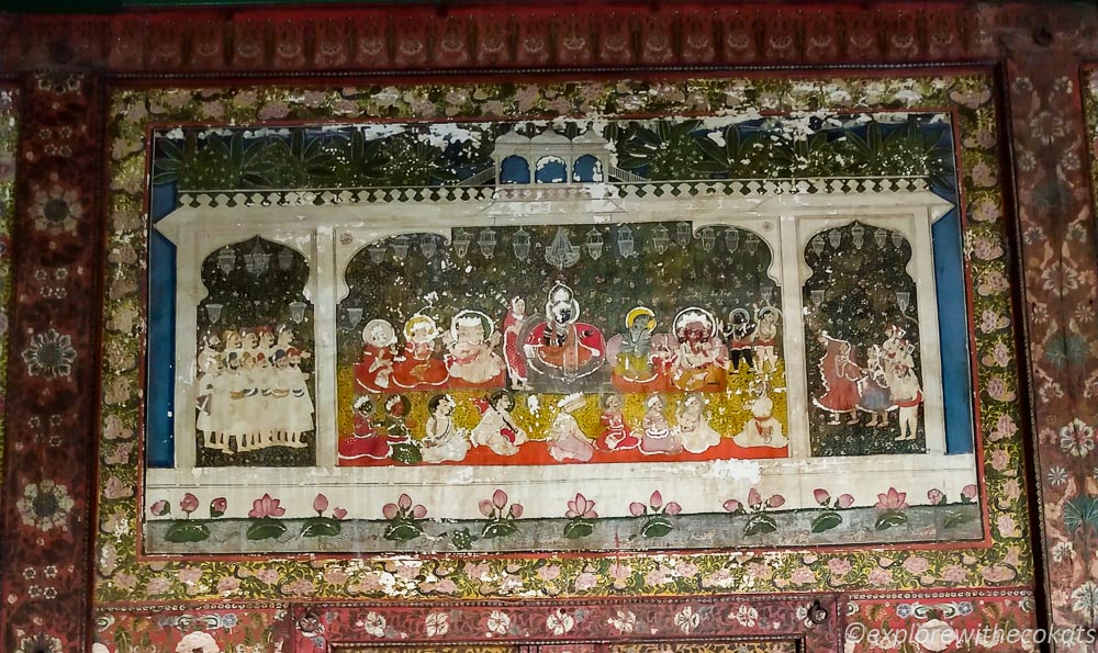 The mural of Krishna on the throne