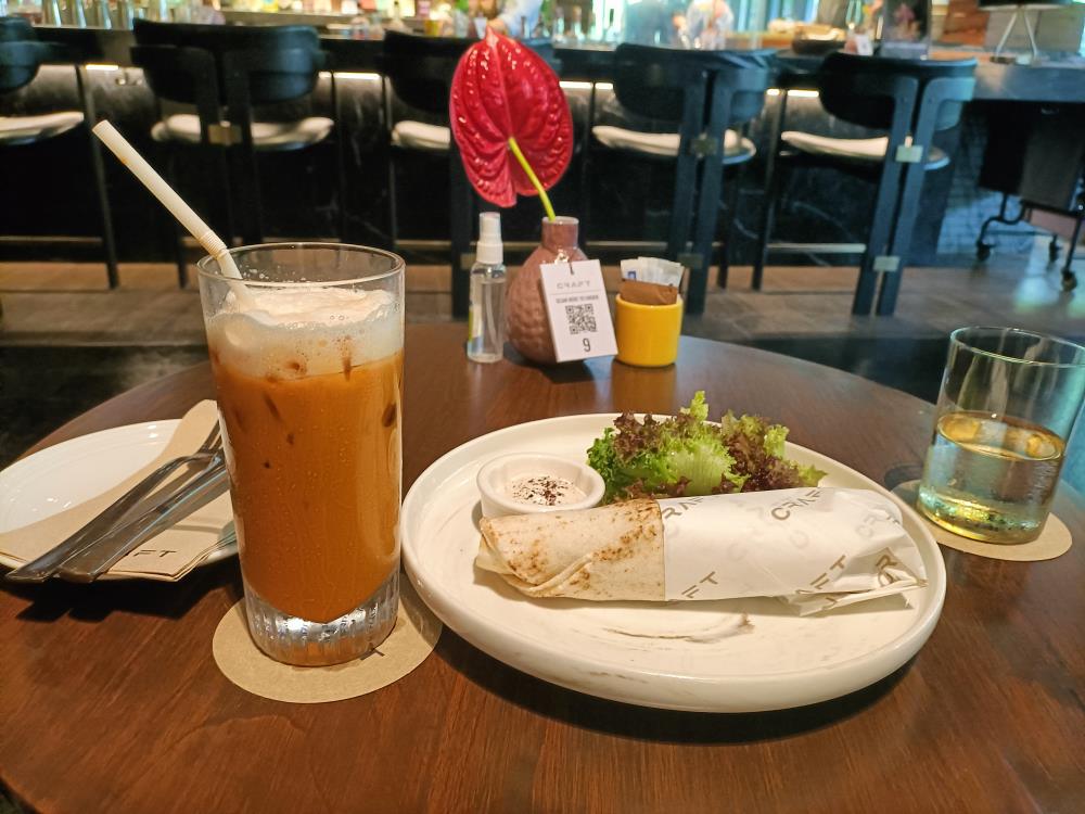 A vegeterian falafel and thai tea at Craft Cafe in Kimpton Maa-Lai Bangkok